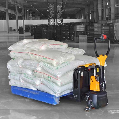Compact electric pallet truck lifting the pallet in the warehouse